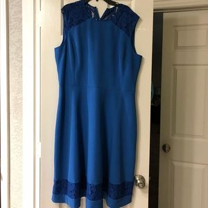 Blue dress with lace accents.